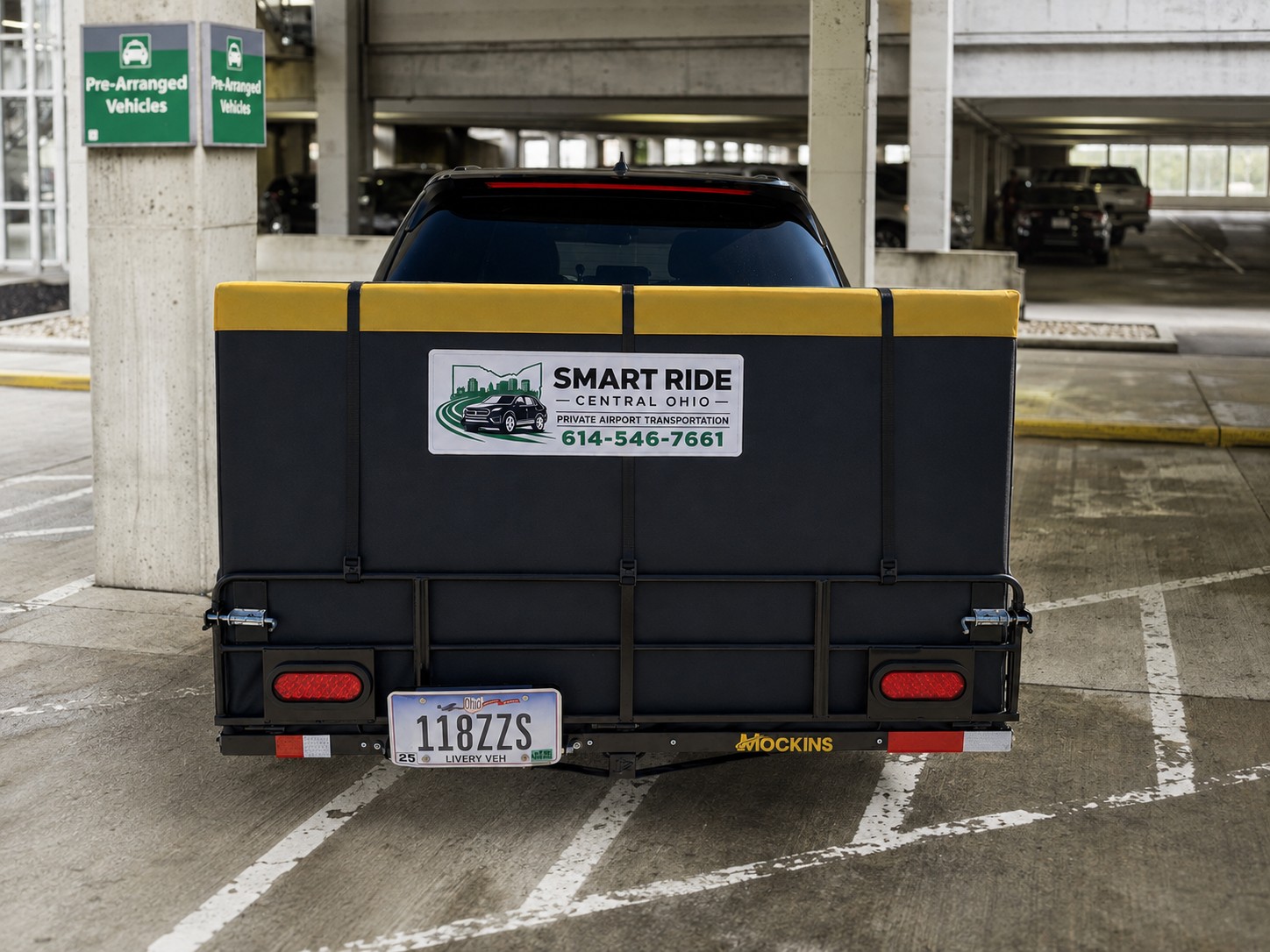 Edited illustration of the closed black and yellow Smart Ride cargo bag mounted behind the Toyota
